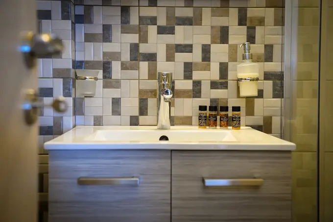 Bathroom vanity with patterned tiles