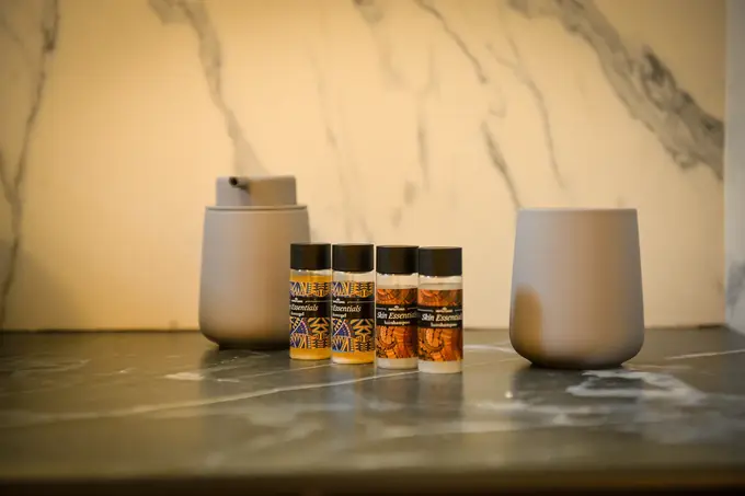 Toiletries on the dark marble counter