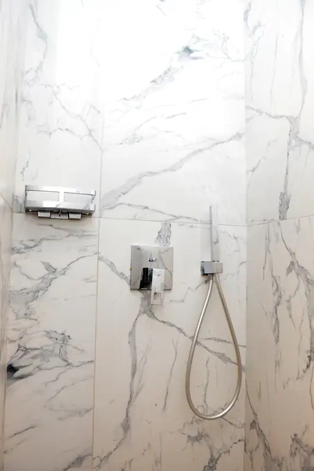 The marble shower with its hand shower