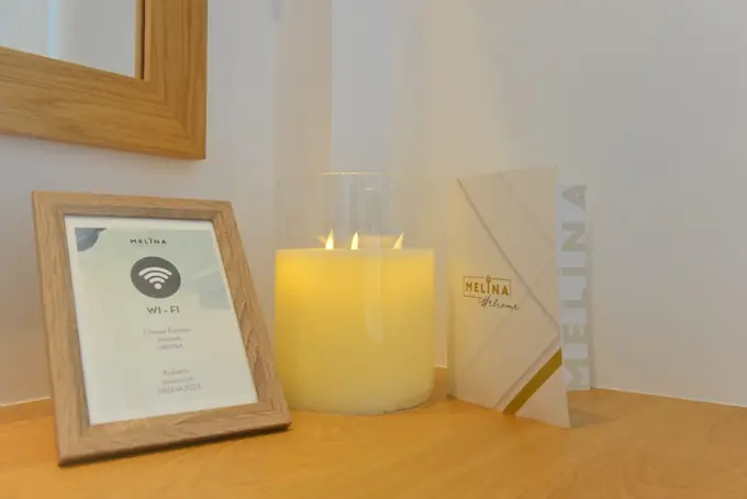 Wi-Fi card, candle and welcome folder